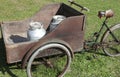 very old bike with milk canister used once a long time ago from Royalty Free Stock Photo