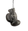 Very old black right boxing glove hanging on a cord Royalty Free Stock Photo