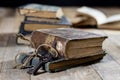 Very old book and key on an old wooden table. Old room, wooden t Royalty Free Stock Photo