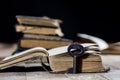 Very old book and key on an old wooden table. Old room, wooden t Royalty Free Stock Photo