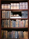 Very old books with leather cover on a shelf Royalty Free Stock Photo