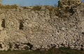 Very old brick stone wall of castle or fortress of 18th century. Full frame wall with obsolete dirty and cracked bricks