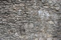 Very old brick stone wall of castle or fortress of 18th century. Full frame wall with obsolete dirty and cracked bricks