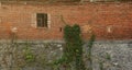 Very old brick stone wall of castle or fortress of 18th century. Full frame wall with obsolete dirty and cracked bricks