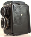 A very old camera that has been isolated with white background