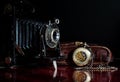 Very old camera and pocket watch Royalty Free Stock Photo