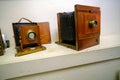 A very old camera on a shelf. Camera in working order. Assembled on a white wall shelf. Royalty Free Stock Photo