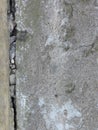 Very old cracked grey wall made of concrete or cement. Brickwork. Plaster.