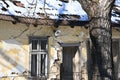 A very old dilapidated yellow house in a mountain village Royalty Free Stock Photo