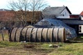 Very old dirty plastic industrial garden greenhouse in front of three small glass garden greenhouses with metal support frame Royalty Free Stock Photo