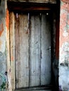 Very old door in ruined house. Royalty Free Stock Photo