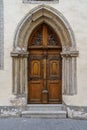 Very old door in stone arch with medieval style. Royalty Free Stock Photo