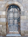 Old blue door in a stone wall Royalty Free Stock Photo