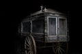 Old abandoned and dusty hearse carriage