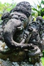 Very old elephant shape stone sculpture covered with moss and lichens in Bali, Indonesia Royalty Free Stock Photo