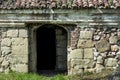 Very old entrance door and stone wall on antique building Royalty Free Stock Photo