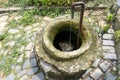 Very old fountain in which clean water flows. Located in the yard of a country house Royalty Free Stock Photo