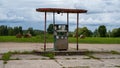 A very old fuel pump in an abandoned station. The old flow measurement used at the pump at the filling station. On the