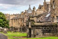 Very old graves located next to dwellings in Greyfriars Cemetery in Edinburgh, Scotland.