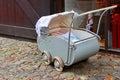 very old gray pram with rubber wheels from the beginning of the last century