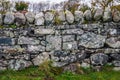 Very old hand made stone wall near the Ardbeg distillery in Scotland UK Royalty Free Stock Photo