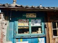 Very old korean house with blue walls, shows the train connection from Seoul to Busan