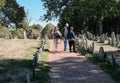 Members of the US public seen looking a old war graves in a Boston cemetery.