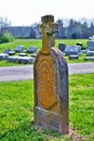 Very old moss covered broken statue / headstone in a cemetery