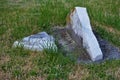 Very old moss covered broken statue / headstone in a cemetery