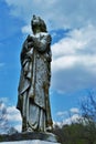 Very old moss covered statue / headstone in a cemetery