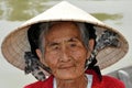 Very old native woman from Vietnam with the traditional hat