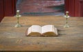 Very old open bible on table in medieval church Royalty Free Stock Photo