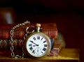 Very old pocket watch and books Royalty Free Stock Photo