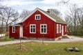 Very old red building of a historical school in Skansen open aur museum in Stockholm, Sweden