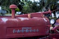 Very old red farm tractor Royalty Free Stock Photo