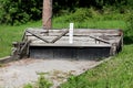 Very old rustic vintage wooden part of makeshift outdoor local version of bowling lane with cracked wooden frame and gravel Royalty Free Stock Photo