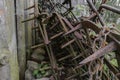 Very old and rusty harrows places near barn wall at countryside Royalty Free Stock Photo