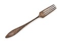 Very old rusty vintage silver fork isolated on a white background, close up, top view