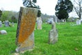 Very old headstone in a cemetery about to fall