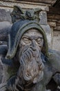 Very old statute of scary gatekeeper, medieval warrior with weapon in historical downtown of Dresden, Germany