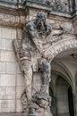 Very old statute of scary gatekeeper, medieval warrior with weapon in historical downtown of Dresden, Germany