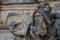 Very old statute of scary and heavy armed gatekeeper, medieval warrior with weapon in historical downtown of Dresden, Germany