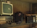 Old televisions and radios on a shelve