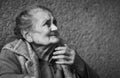 Very old and tired wrinkled woman outdoors Royalty Free Stock Photo