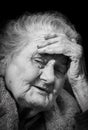 Very old and tired wrinkled woman outdoors Royalty Free Stock Photo