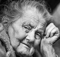 Very old and tired wrinkled woman outdoors Royalty Free Stock Photo