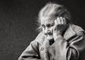 Very old and tired wrinkled woman outdoors Royalty Free Stock Photo