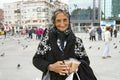 A very old Turkish woman selling birdseeds