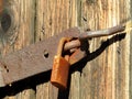 Very old wooden door locked with a padlock Royalty Free Stock Photo