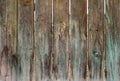 Very old wooden fence, once painted green, old wood texture Royalty Free Stock Photo